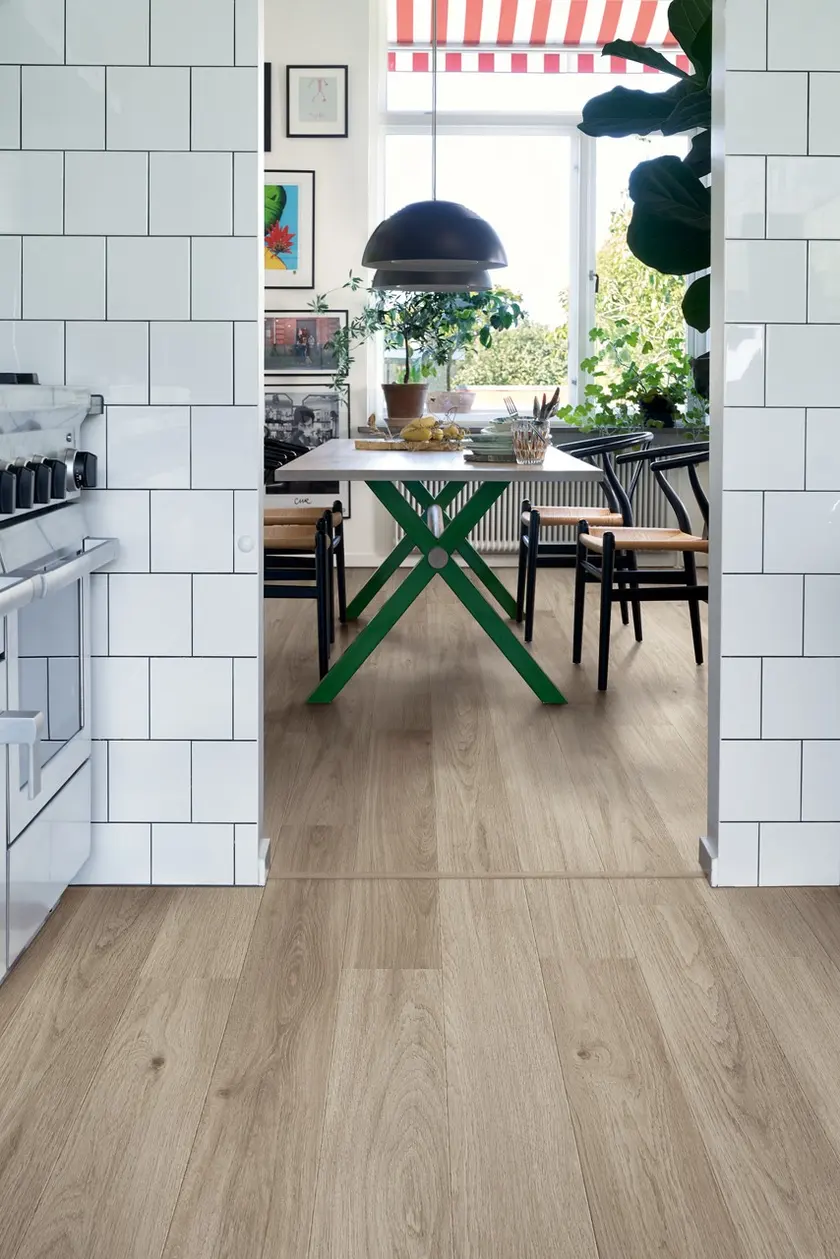 A Scandinavian kitchen and dining room with a Pergo floor
